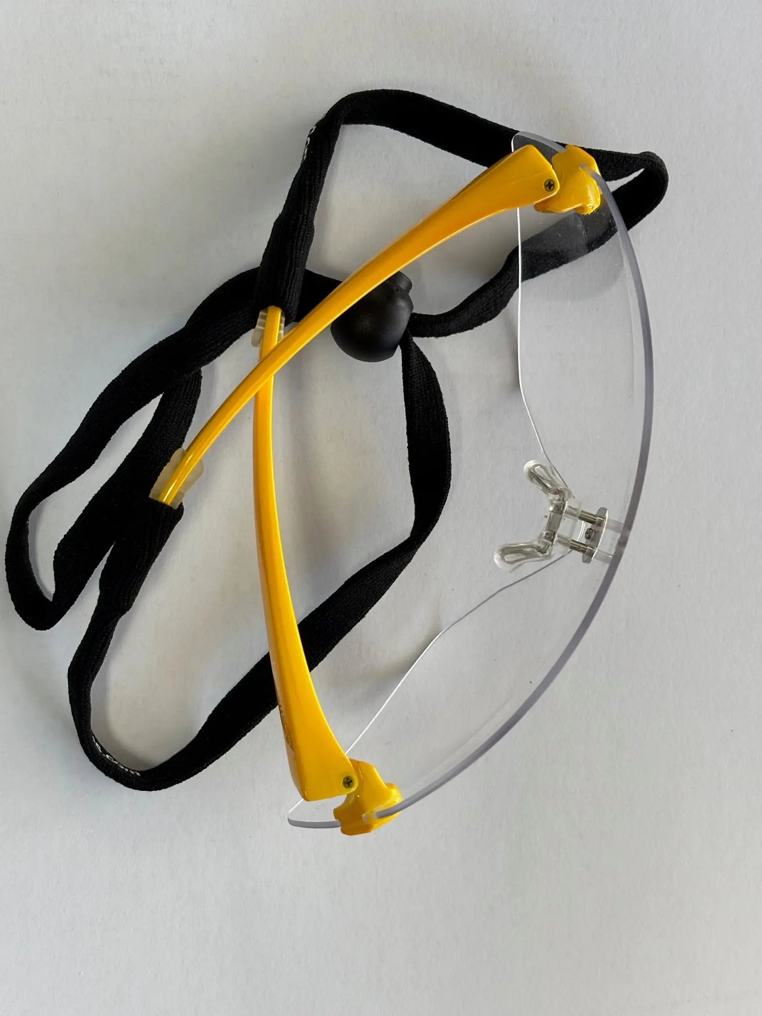 Hogies Glove Cord attached to Yellow EyeGuard Safety Glasses.