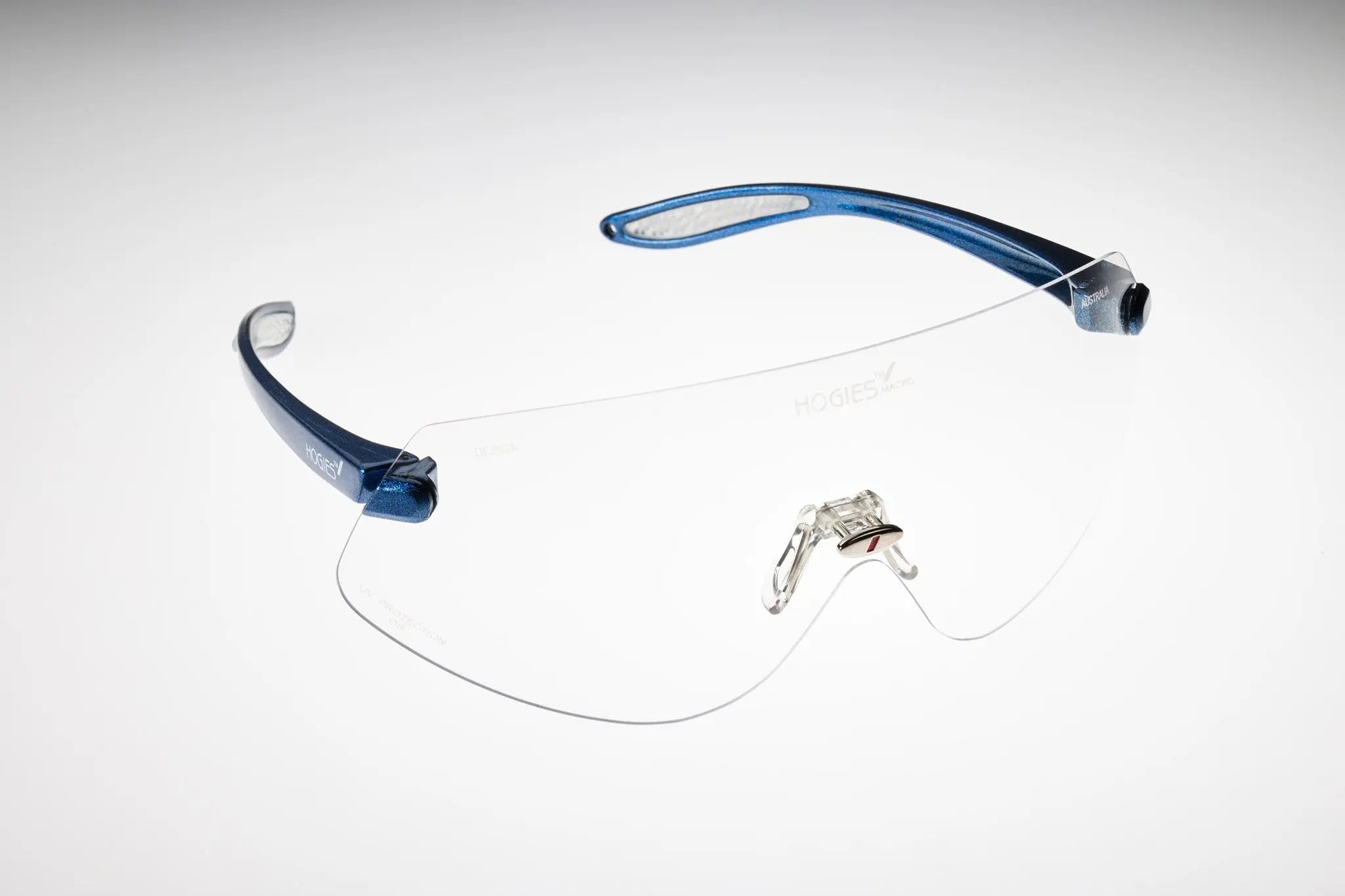 Clear safety glasses with a blue lanyard frame. The glasses are designed for large head shapes and meet low impact requirements of AS/NZS 1337.